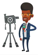 Man with afro standing next to tripod and camera